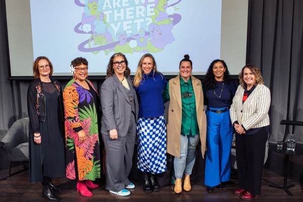 Seven women pose for photo